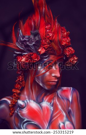 Portrait of painted woman in original head wear