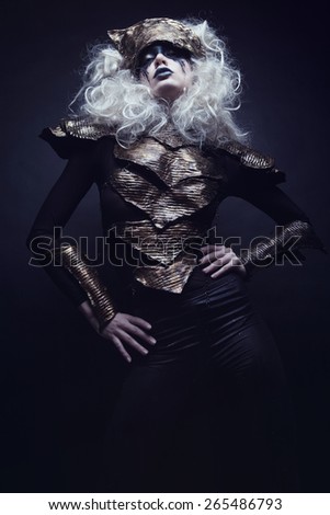 Woman with black make up and white wig