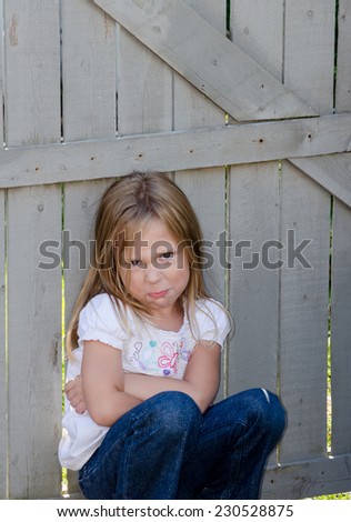 unhappy little girl with a attitude