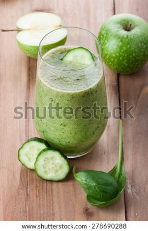 green vegetable drink on the table. Rustic style . Useful vitamin drink made from green fruit