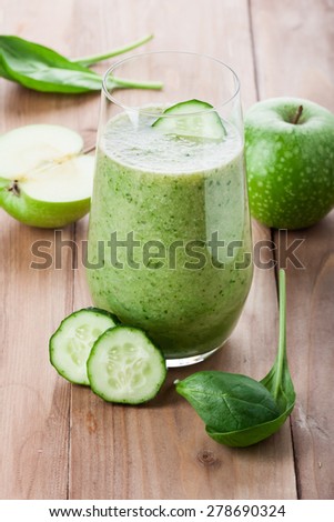 green vegetable drink on the table. Rustic style . Useful vitamin drink made from green fruit