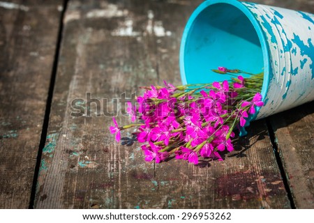 lovely bouquet of wild flowers in a jug handmade. focus on the petals of a flower. there is room for designer labels . Picture perfect for greetings and announcements
