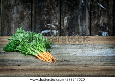 carrots on the board texture . rural style . natural ingredient for vegan salad. there\'s space for an inscription