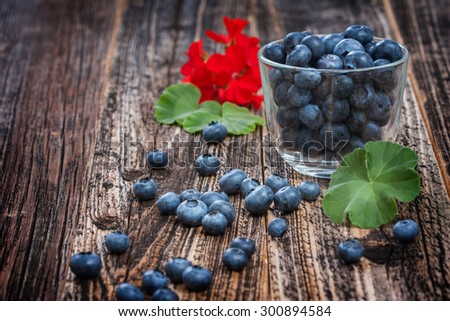 blueberries in a glass. ripe sweet berry . environmentally friendly product. country style. focus on berries in a cup