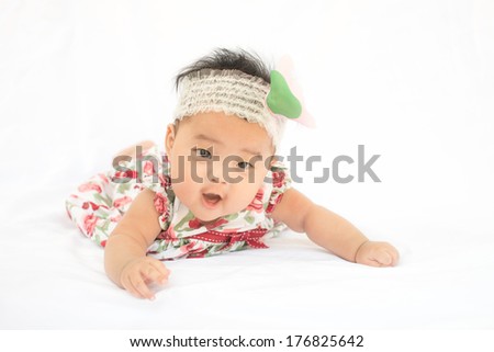 asian cute baby girl smile with big rose headband