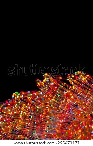 Multicolor flexible light strip decoration over black background