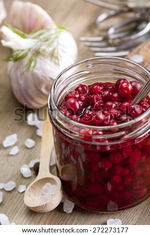 Home-made canned cranberry and cowberry