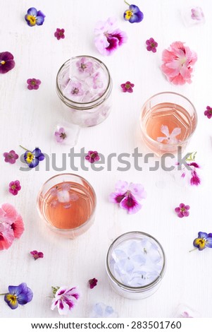 Pretty edible ice cubes in mason jars and rose wine
