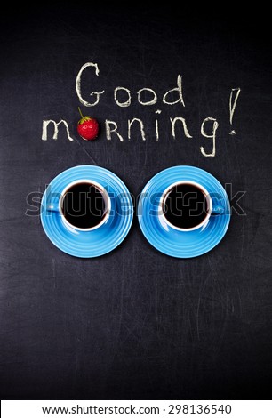 A morning coffee concept with two blue cups and a \
