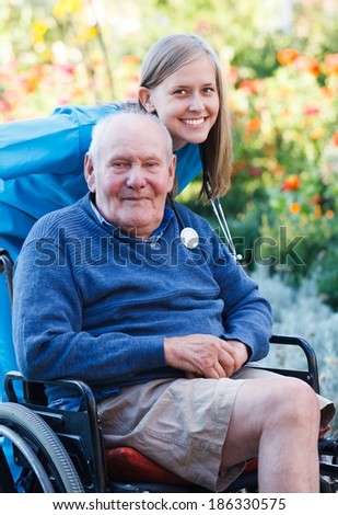 Disabled old man being pleased with the quality of the homecare service.