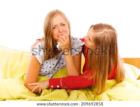 Kind woman consoling her crying upset girlfriend.