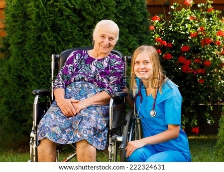Kind doctor taking care of elderly woman at the nursing home.