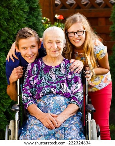 Teenager grandchildren visiting their old disabled grandmother.