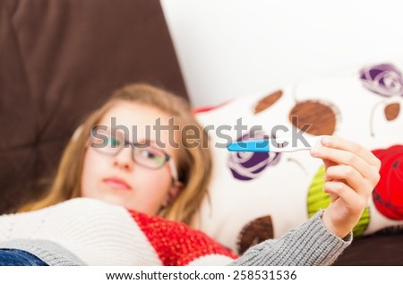 Teenage girl showing her positive pregnancy test.