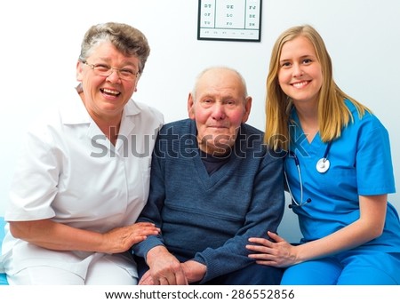 Great mood at the hospital- smiling elderly man with his doctor and nurse.