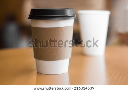 Two paper coffee cups