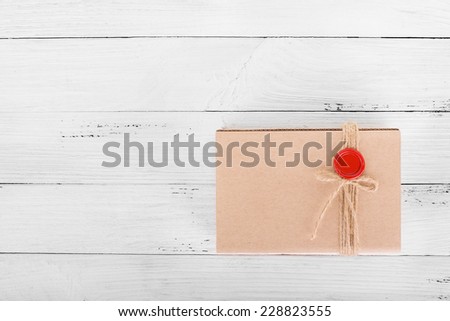 Craft package gift box on white wooden background