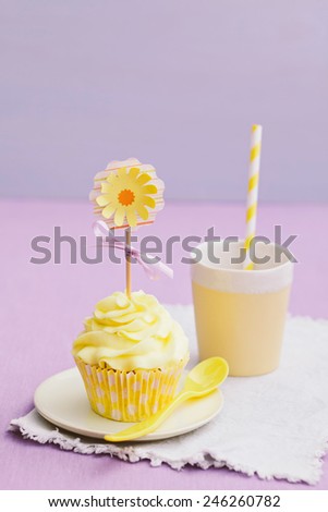 Decorated yellow cupcakes for a summer party or birthday