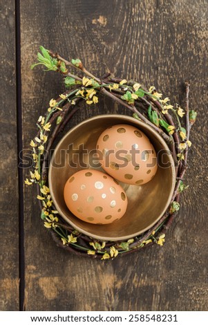 Eggs with golden dots in a golden bowl