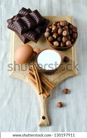 Baking products : chocolate, nuts , milk, cinnamon, egg  , selective focus