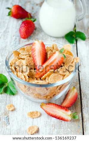 Corn flakes with strawberry and milk, Selective focus
