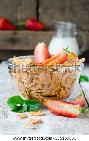 Corn flakes with strawberries , Breakfast .Selective focus