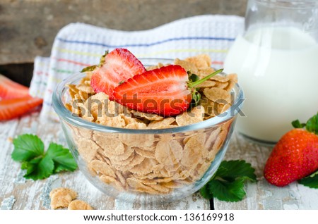 Corn flakes with strawberries , Breakfast .Selective focus