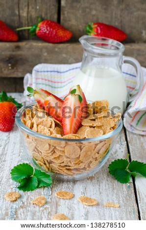 Corn flakes with strawberries , Breakfast .