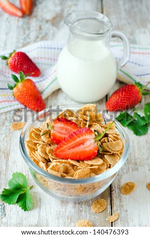 Corn flakes with strawberries , Breakfast .