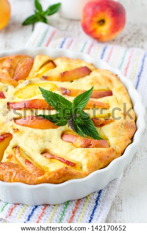 Cottage cheese baked pudding with a peach. Selective focus