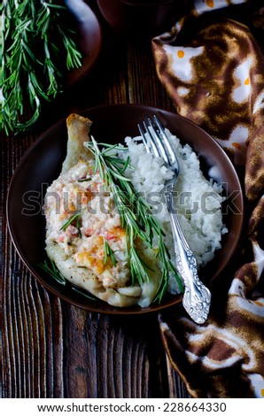 Tilapia baked with cheese and tomato, garnished with rice