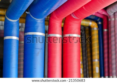 Industrial pipes covered with colorful insulation