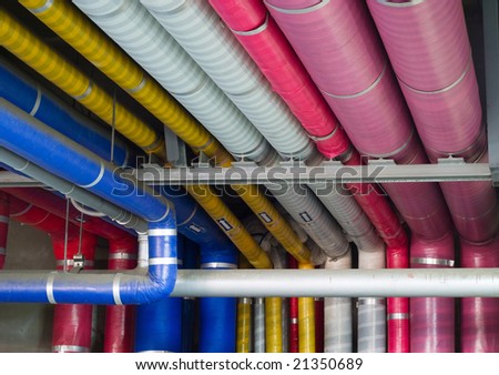 Industrial pipes covered with colorful insulation