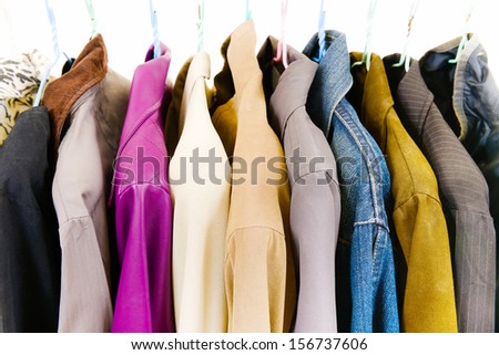 Clothes of different colors on hanger