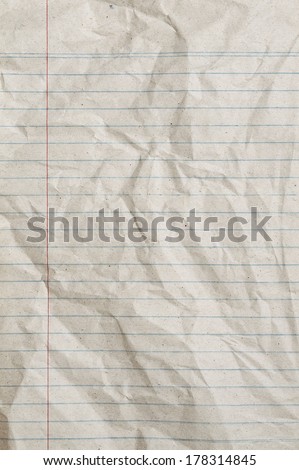 Rumpled vintage sheet of lined paper or notebook paper with left margin