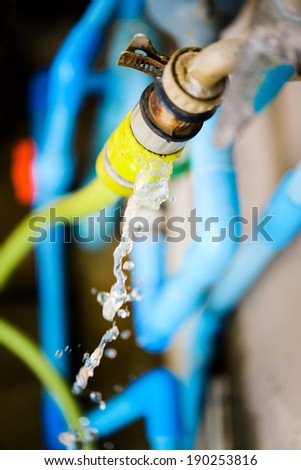 Wasting water - water leaking from water tap