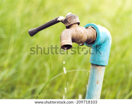 Wasting water - water drop from water tap