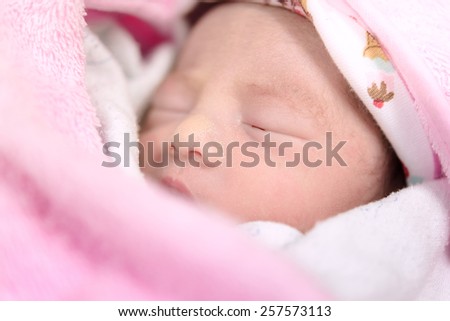 New born baby infant asleep in the blanket
