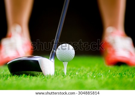 Playing golf - shot of golf ball with golf club