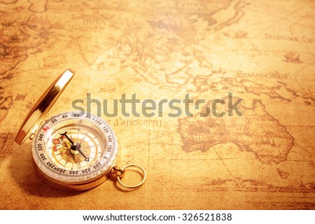 Old vintage compass on vintage map