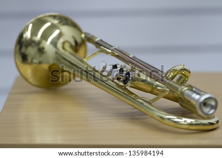 Trumpet on the table. Classic musical instrument.