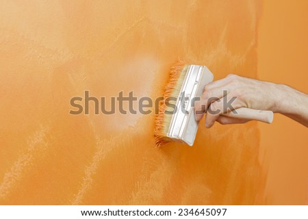 Creating a pattern orange decorative paint.
