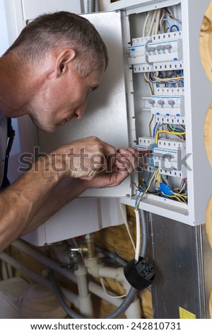 Electrician connect the power supply to the power board.