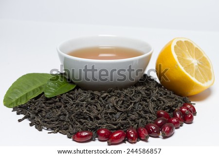 Ceylon black tea, rose, lemon and tonic brewed of them into a bowl.