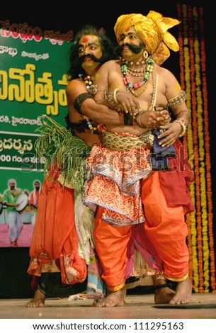 HYDERABAD,AP,INDIA-AUGUST 22: Viranatyam A folk dance form dancers perform during world folk art day event in ravindra bharati on August 22,2012 in Hyderabad,Ap,India.