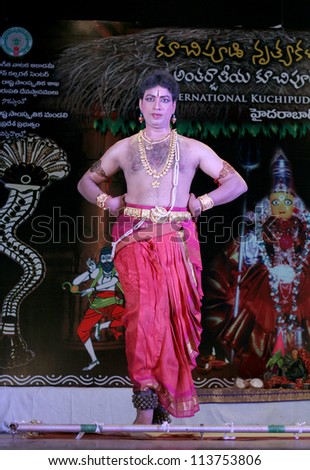 HYDERABAD,AP,INDIA-MAY 27:Artist perform during International Kuchipudi dance festival at Ravindra bharati on May27,2012 in Hyderabad,Ap,India.A dance form of drawing lion and other art with feet.