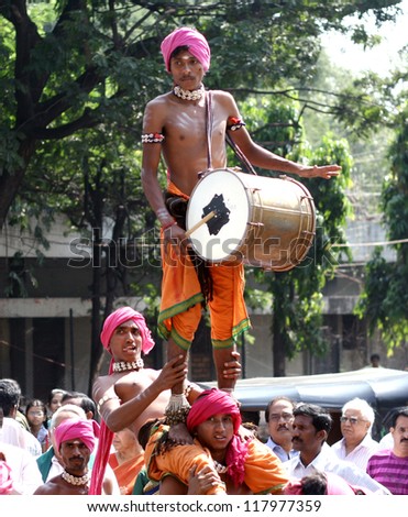 HYDERABAD,AP,INDIA-OCTOBER 27:Tribals perform dappu dance during inaguration of four-day Kalarchana event by Bharateeyam on October27,2012 in Hyderabad,India. Event promoting culture and tradtions.