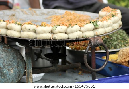 Hyderabad,Ap,India-September 18:People Buy / Eat Street Food On Abundant During Ganesha Immersion ,A Festival,On September 18,2013 In Hyderabad,India.Traders Use Mobile Carts To Conduct Business.