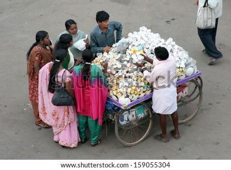 HYDERABAD,AP,INDIA-OCTOBER 1:People shopping in the street market near charminar on October 1,2013 in Hyderabad,Ap,India.