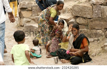 HYDERABAD,INDIA-JULY 7,2014:Indian beggars seek help during Bonalu festival near temple in Golconda fort  in Hyderabad,India on July 7,2014.annual festival in  Golconda. before temples.